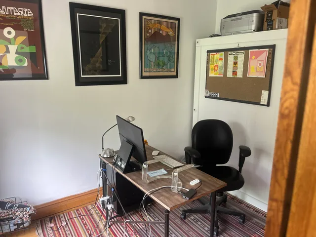 a workspace with furniture and a window