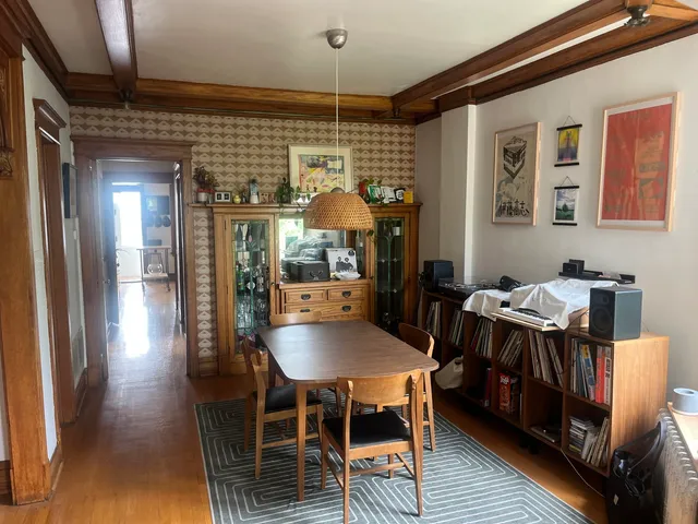 a dining room with furniture and window