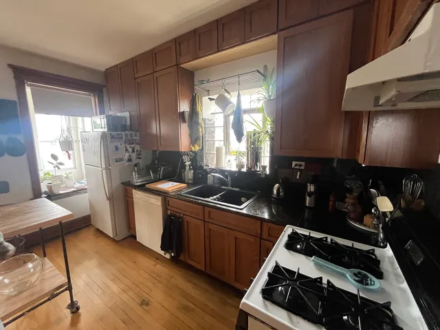 a kitchen with a stove and a refrigerator