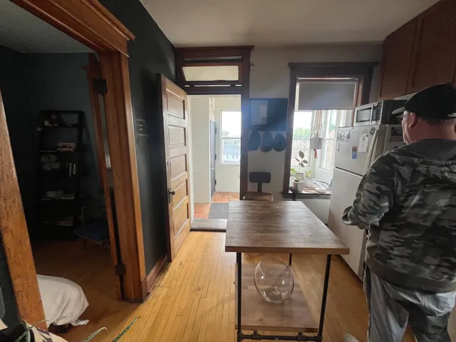 a view of kitchen island with furniture and wooden floor