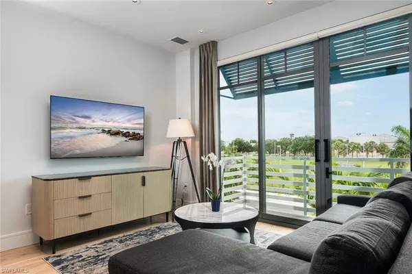 a living room with furniture and a large window