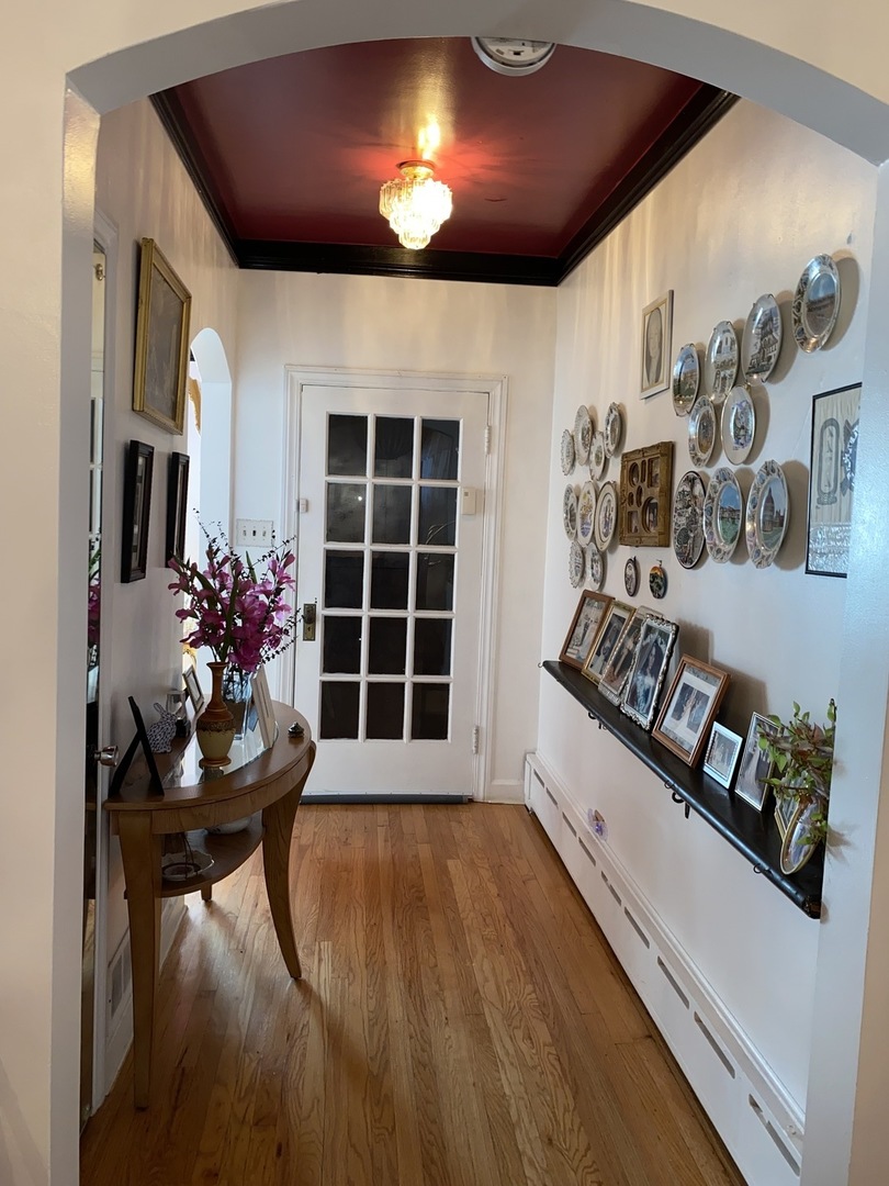 Undisclosed Address Chicago, IL 60639 - Photo 3 of 20 a view of a livingroom with furniture and wooden floor