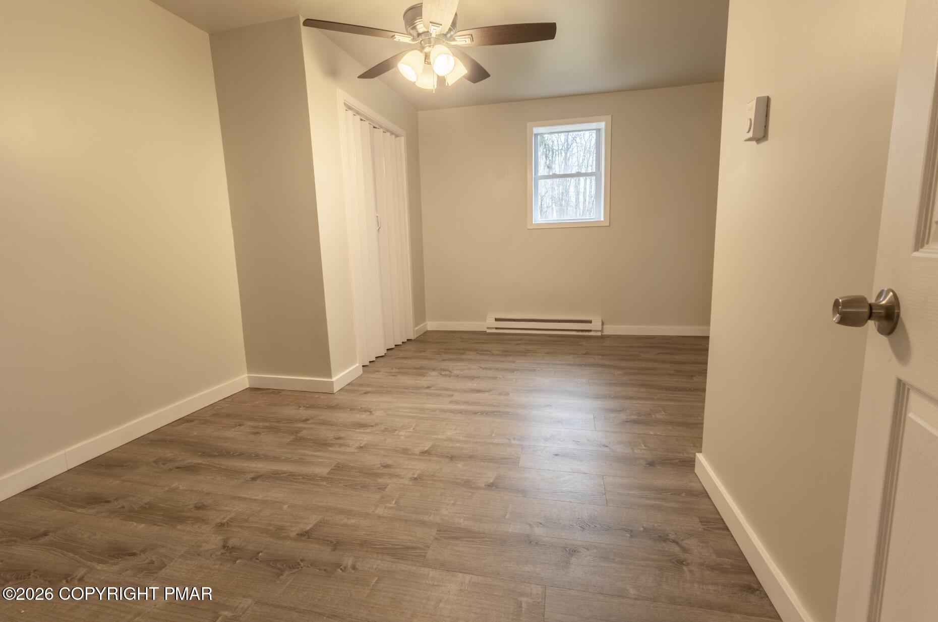 600 Rte 115 Saylorsburg, PA 18353 - Photo 12 of 26 a view of an empty room with wooden floor and a window