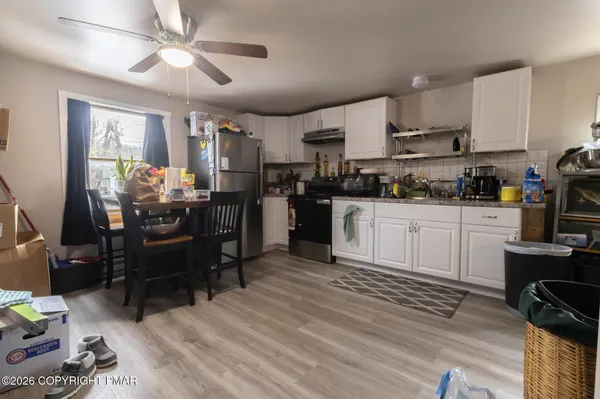 a kitchen with a sink cabinets and window