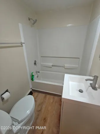 a bathroom with a toilet and a sink
