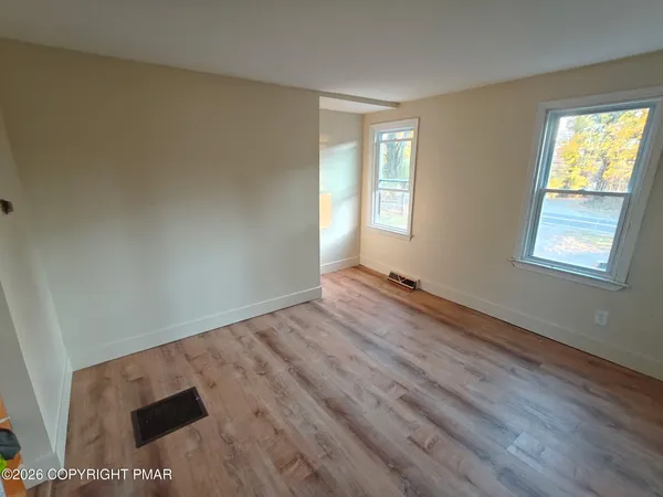 a view of an empty room and window