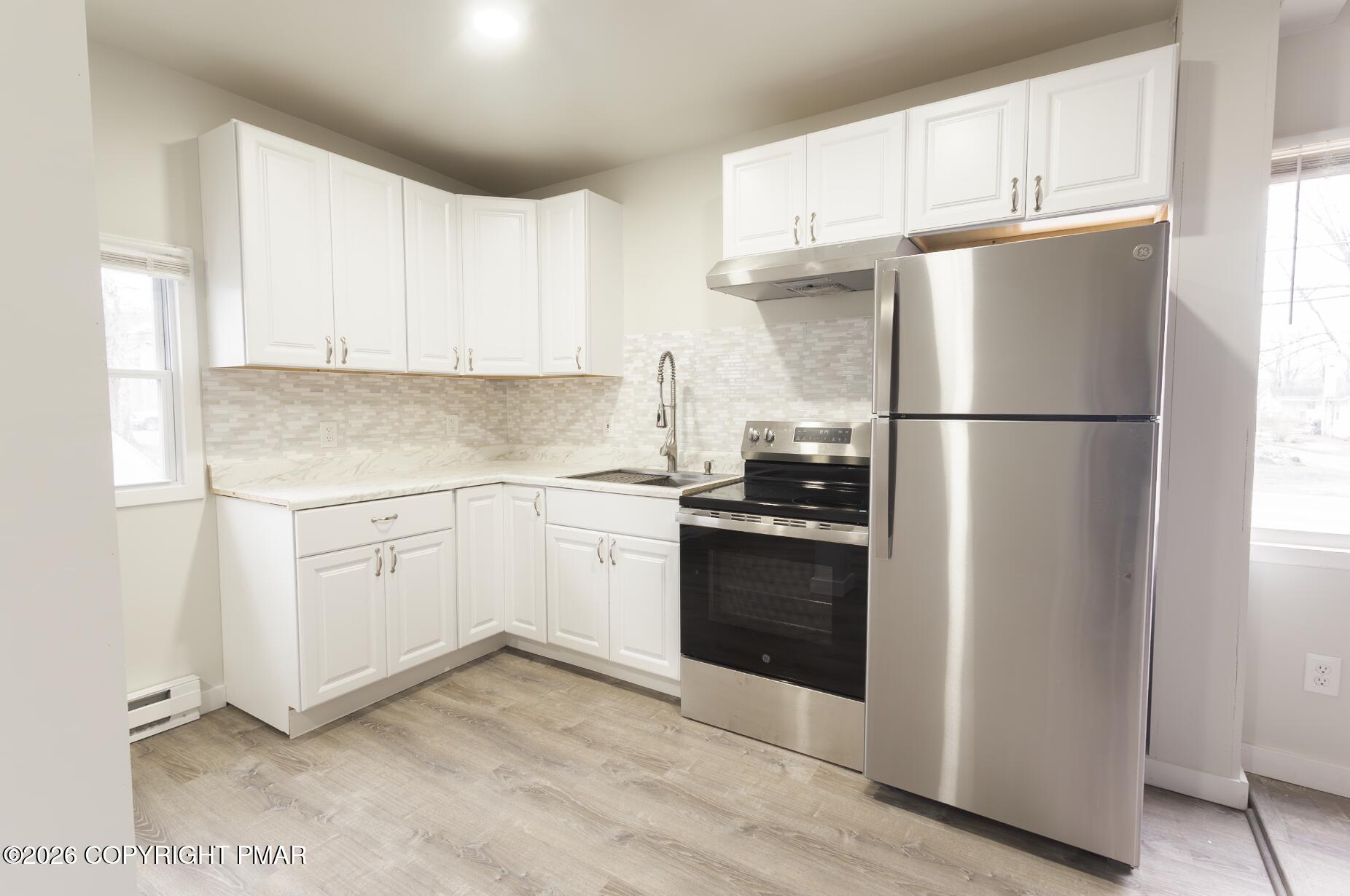 600 Rte 115 Saylorsburg, PA 18353 - Photo 5 of 26 a kitchen with a refrigerator sink and cabinets