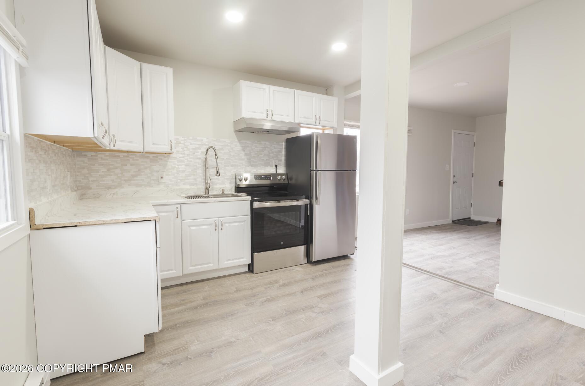 600 Rte 115 Saylorsburg, PA 18353 - Photo 6 of 26 a kitchen with stainless steel appliances a refrigerator sink and cabinets