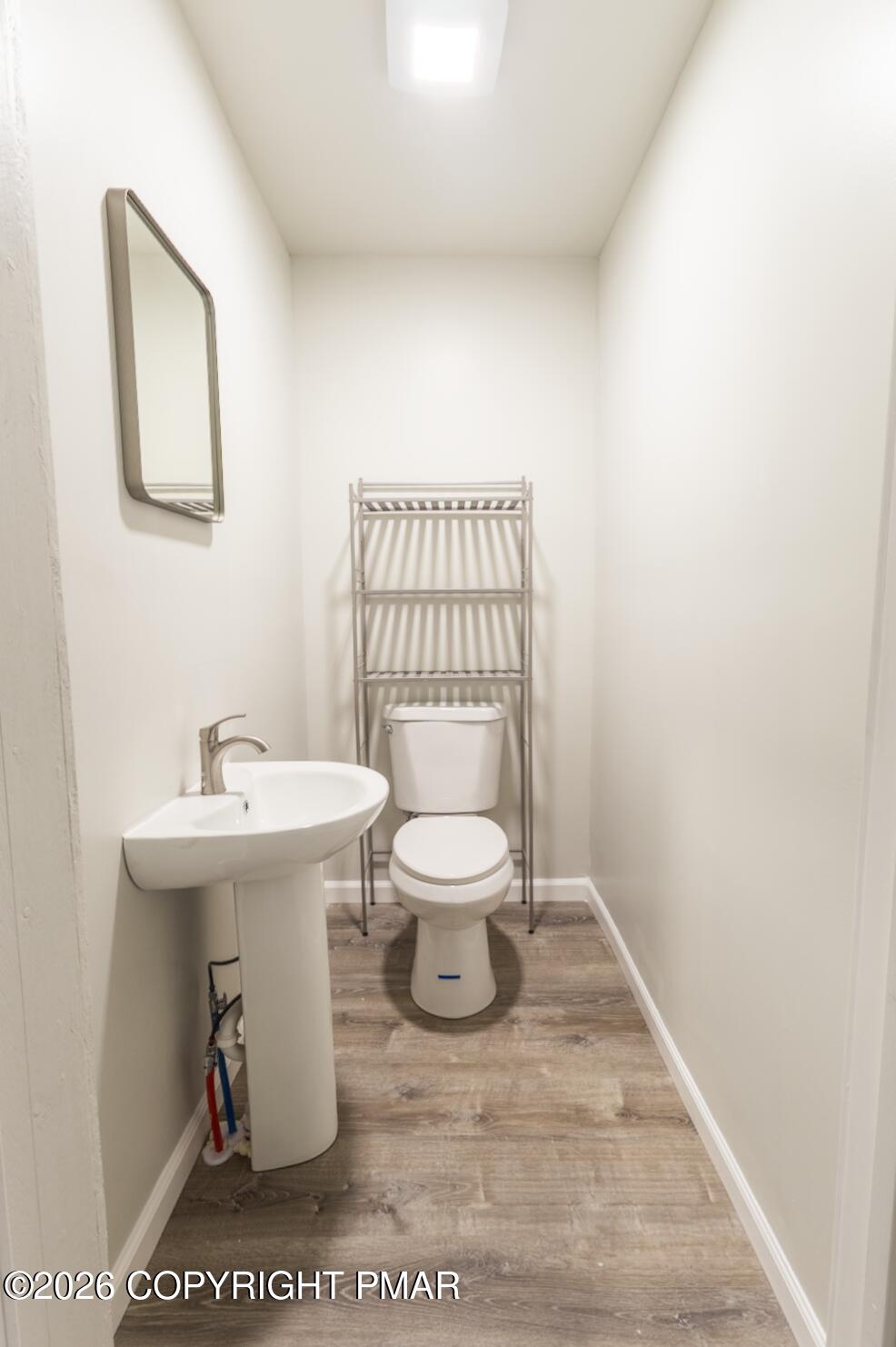 600 Rte 115 Saylorsburg, PA 18353 - Photo 8 of 26 a white toilet sitting next to a bathroom sink