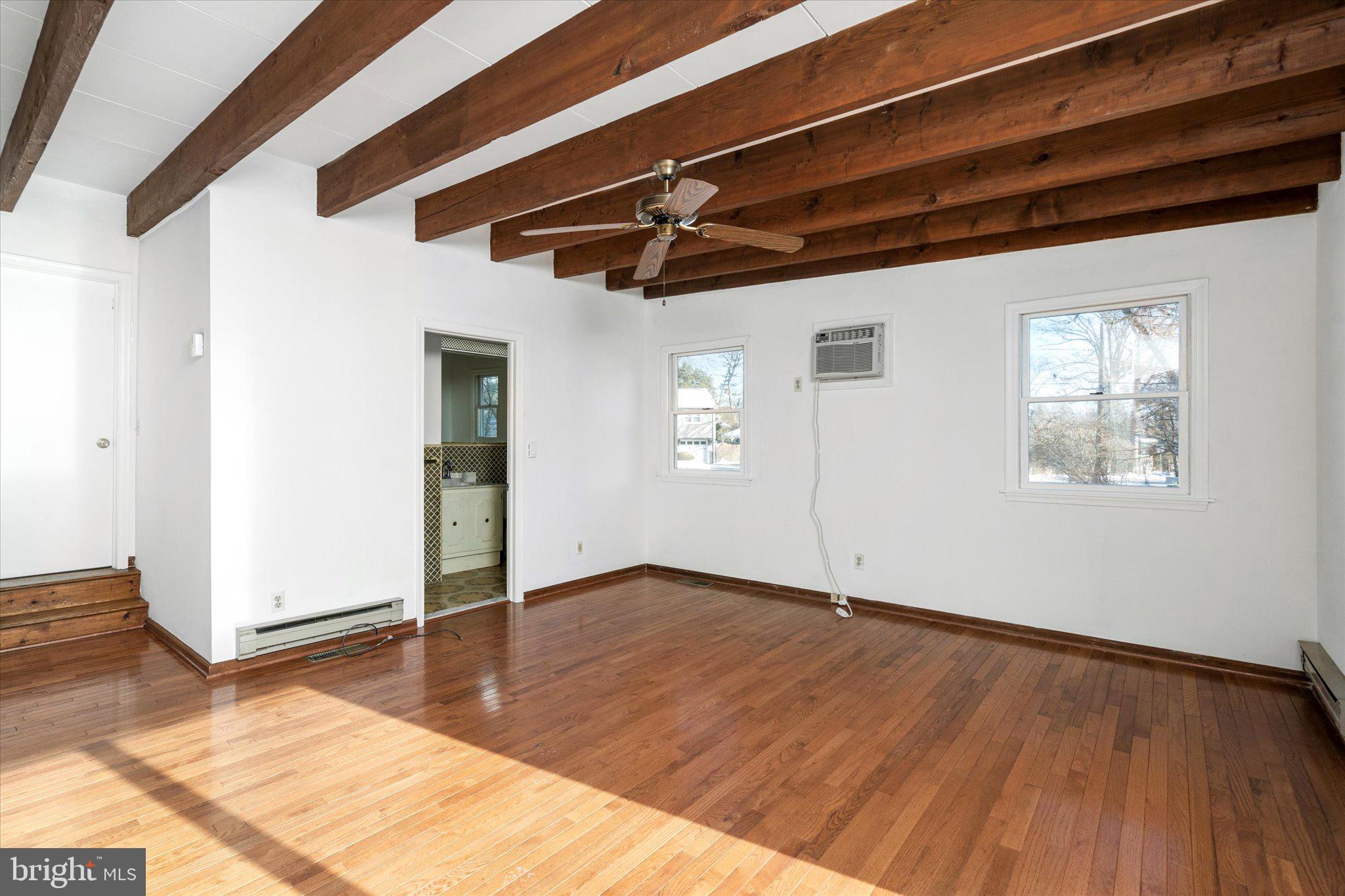 331 Hamilton Avenue Princeton, NJ 08540 - Photo 16 of 31 an empty room with wooden floor ceiling fan and windows