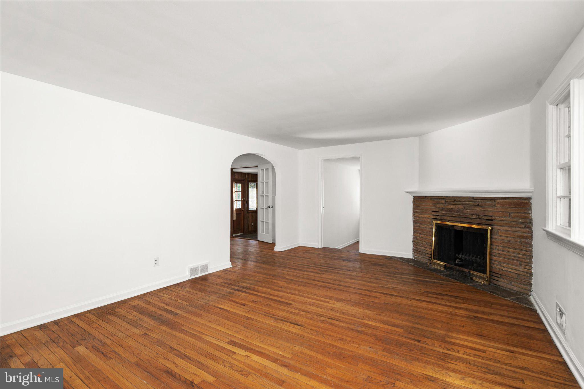 331 Hamilton Avenue Princeton, NJ 08540 - Photo 2 of 31 a view of empty room with wooden floor and fireplace