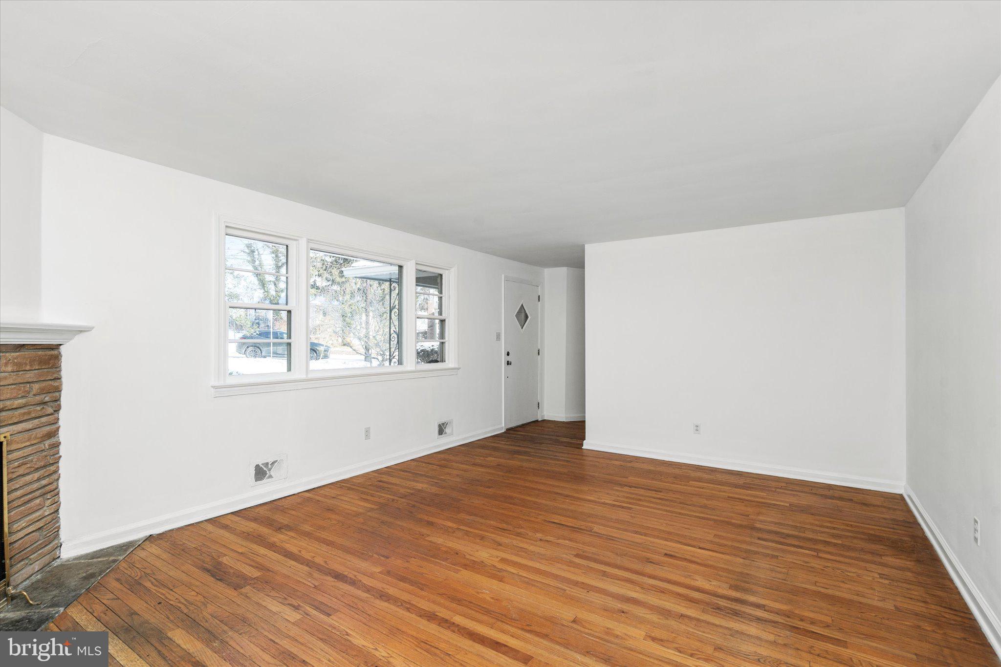 331 Hamilton Avenue Princeton, NJ 08540 - Photo 3 of 31 an empty room with wooden floor and windows