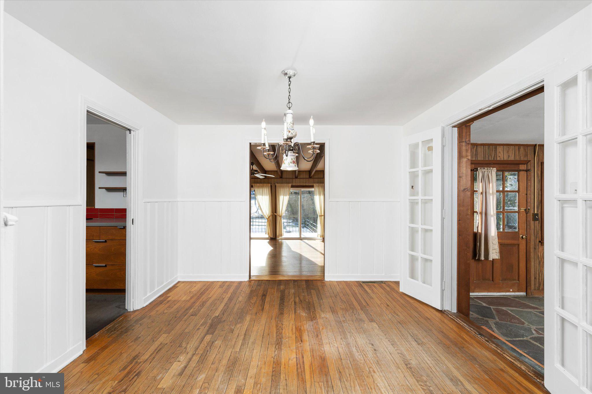 331 Hamilton Avenue Princeton, NJ 08540 - Photo 4 of 31 an empty room with wooden floor cabinet and windows