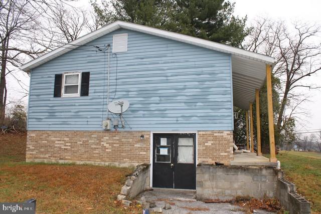 6525 Charlestown Road Mercersburg, PA 17236 - Photo 4 of 5 a front view of a house with garden