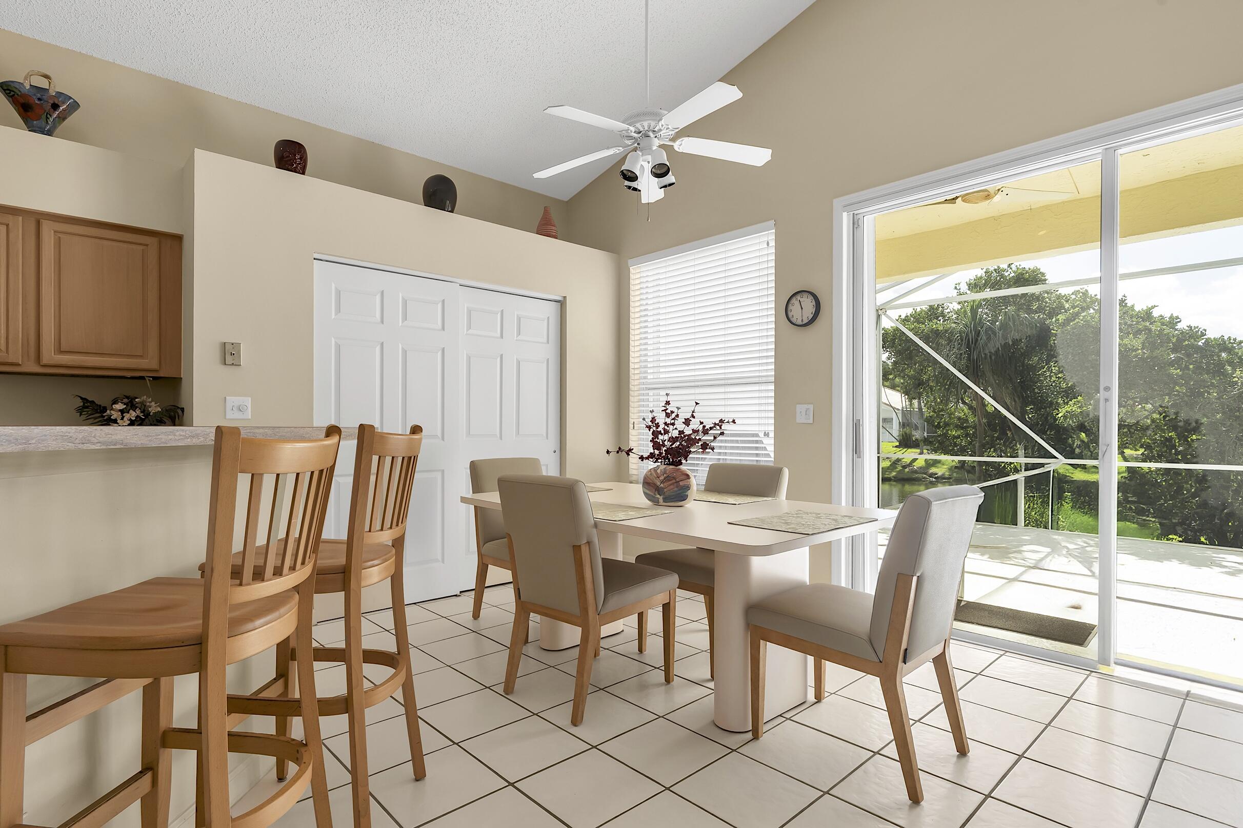 7507 Eagle Point Drive Delray Beach, FL 33446 - Photo 18 of 49 a view of a dining room with furniture window and outside view