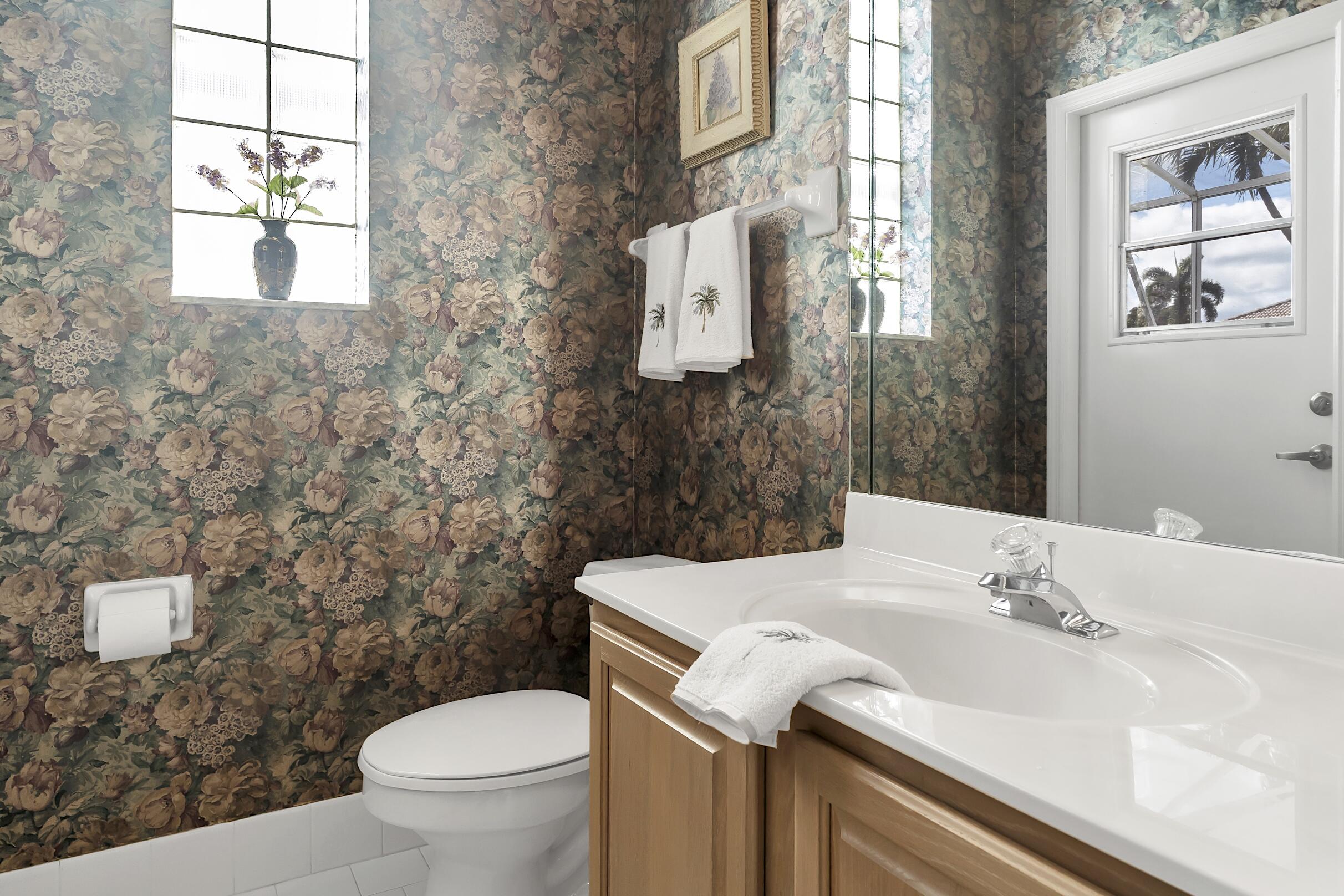 7507 Eagle Point Drive Delray Beach, FL 33446 - Photo 22 of 49 a bathroom with a sink and a toilet