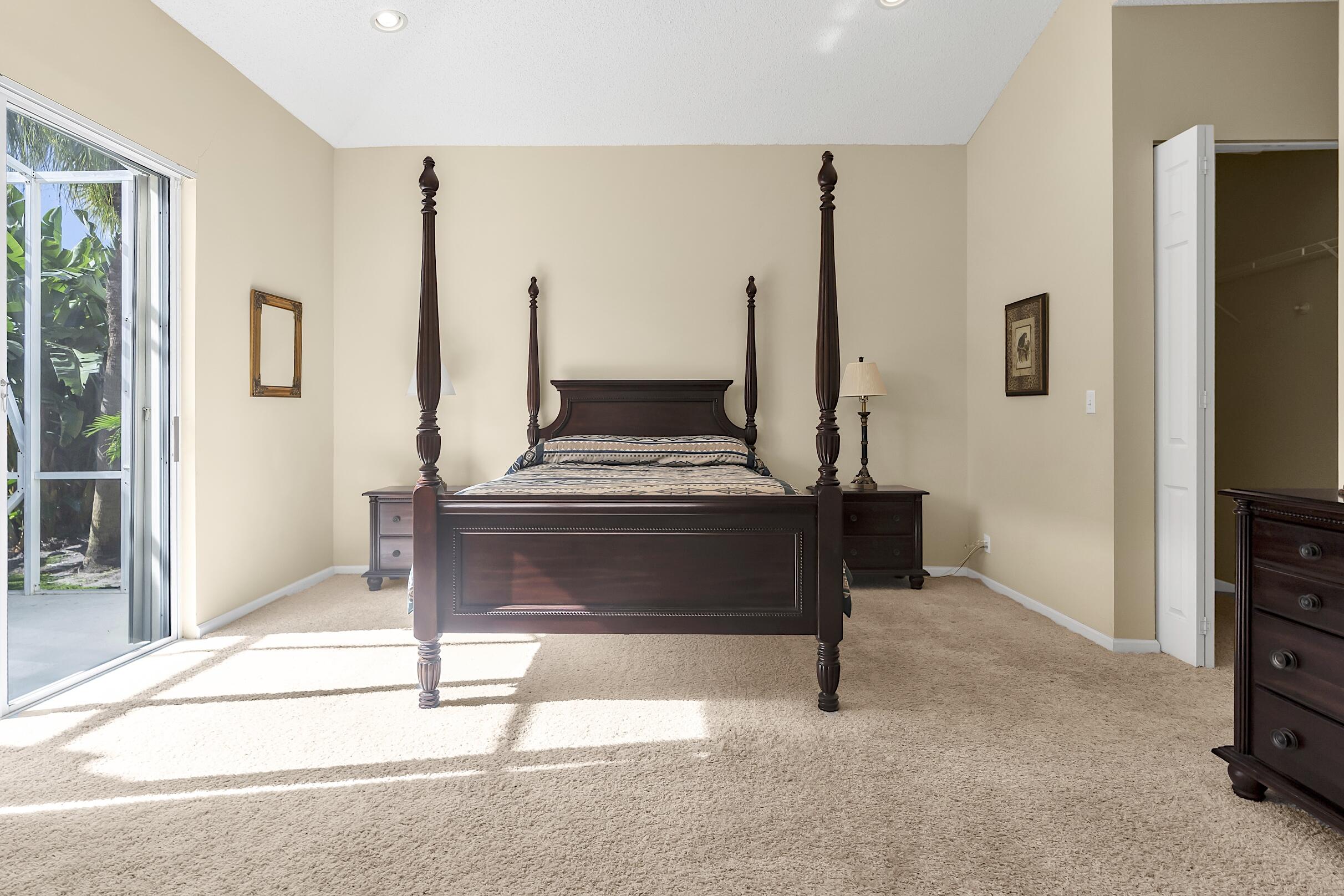 7507 Eagle Point Drive Delray Beach, FL 33446 - Photo 23 of 49 a living room with furniture a flat screen tv and a table