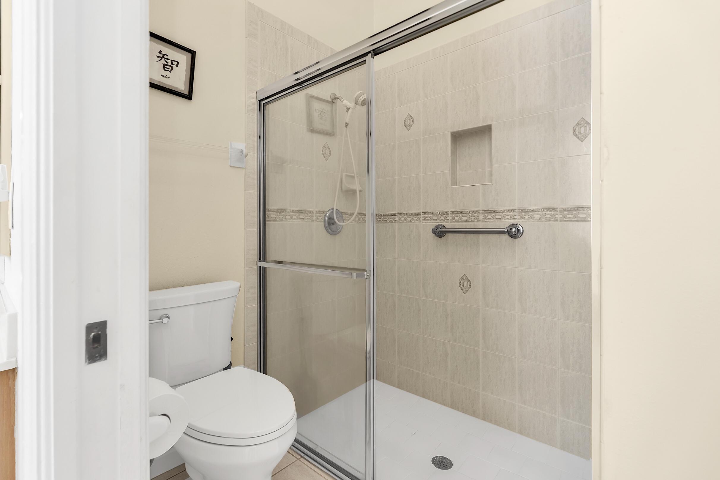 7507 Eagle Point Drive Delray Beach, FL 33446 - Photo 30 of 49 a bathroom with a shower and a toilet