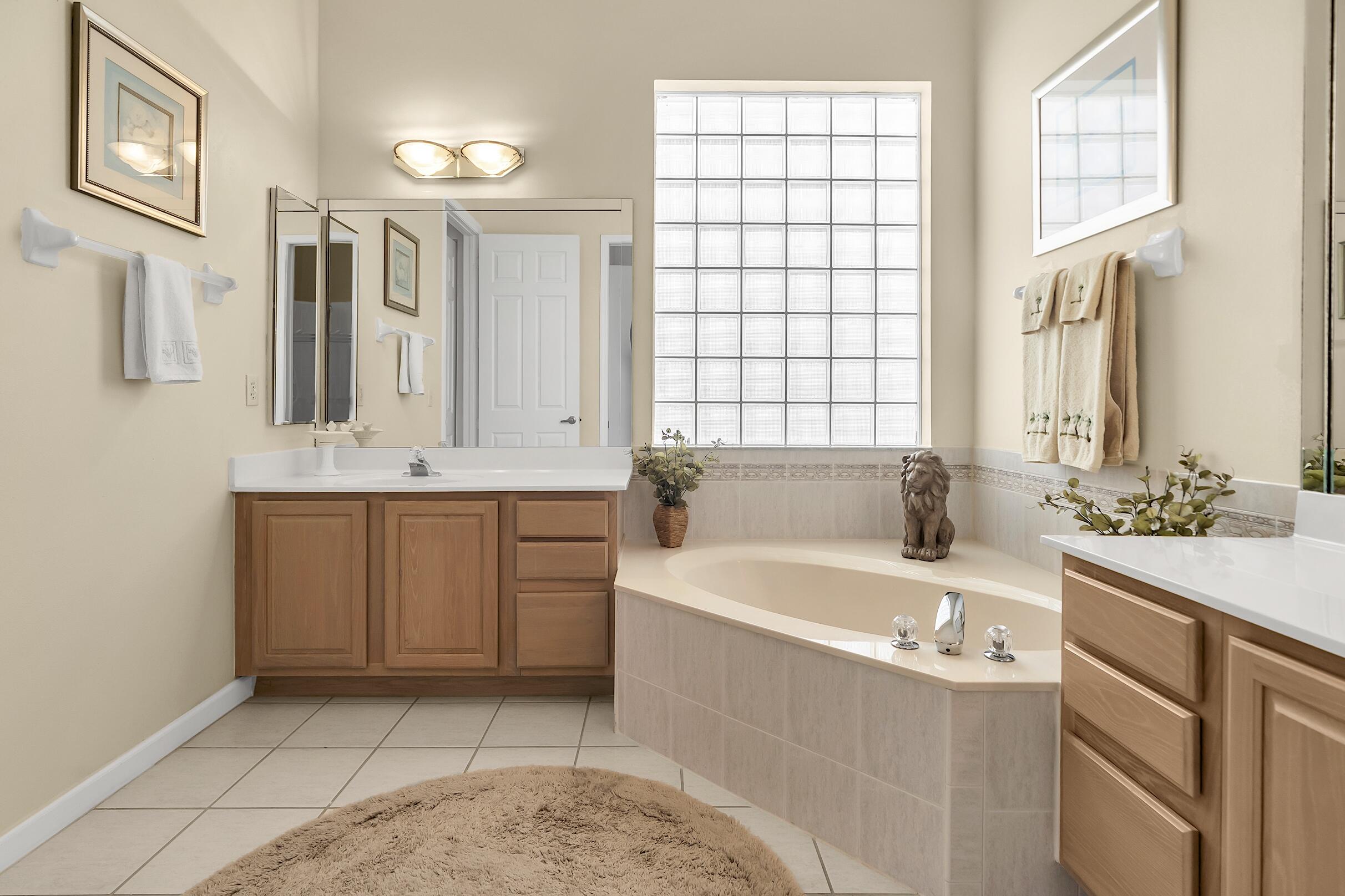 7507 Eagle Point Drive Delray Beach, FL 33446 - Photo 31 of 49 a bathroom with a sink and a bathtub