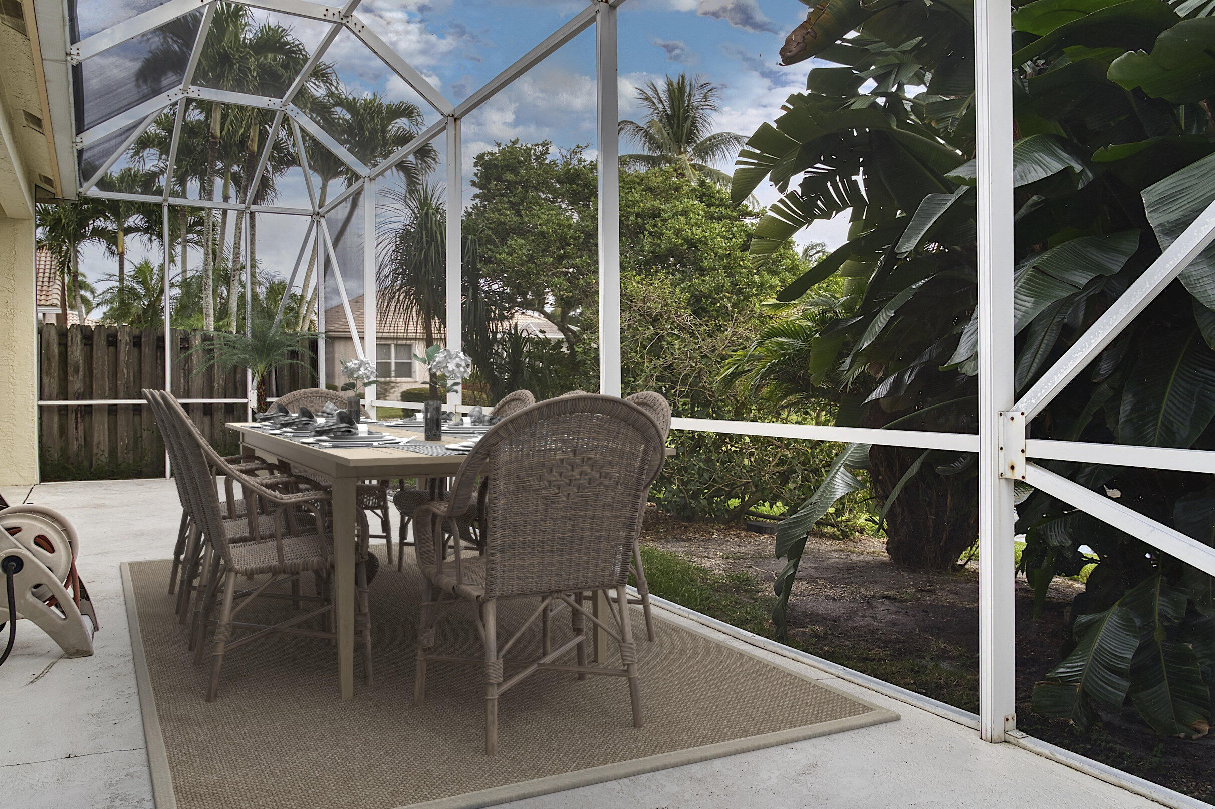 7507 Eagle Point Drive Delray Beach, FL 33446 - Photo 39 of 49 a view of a patio with a table chairs and a backyard