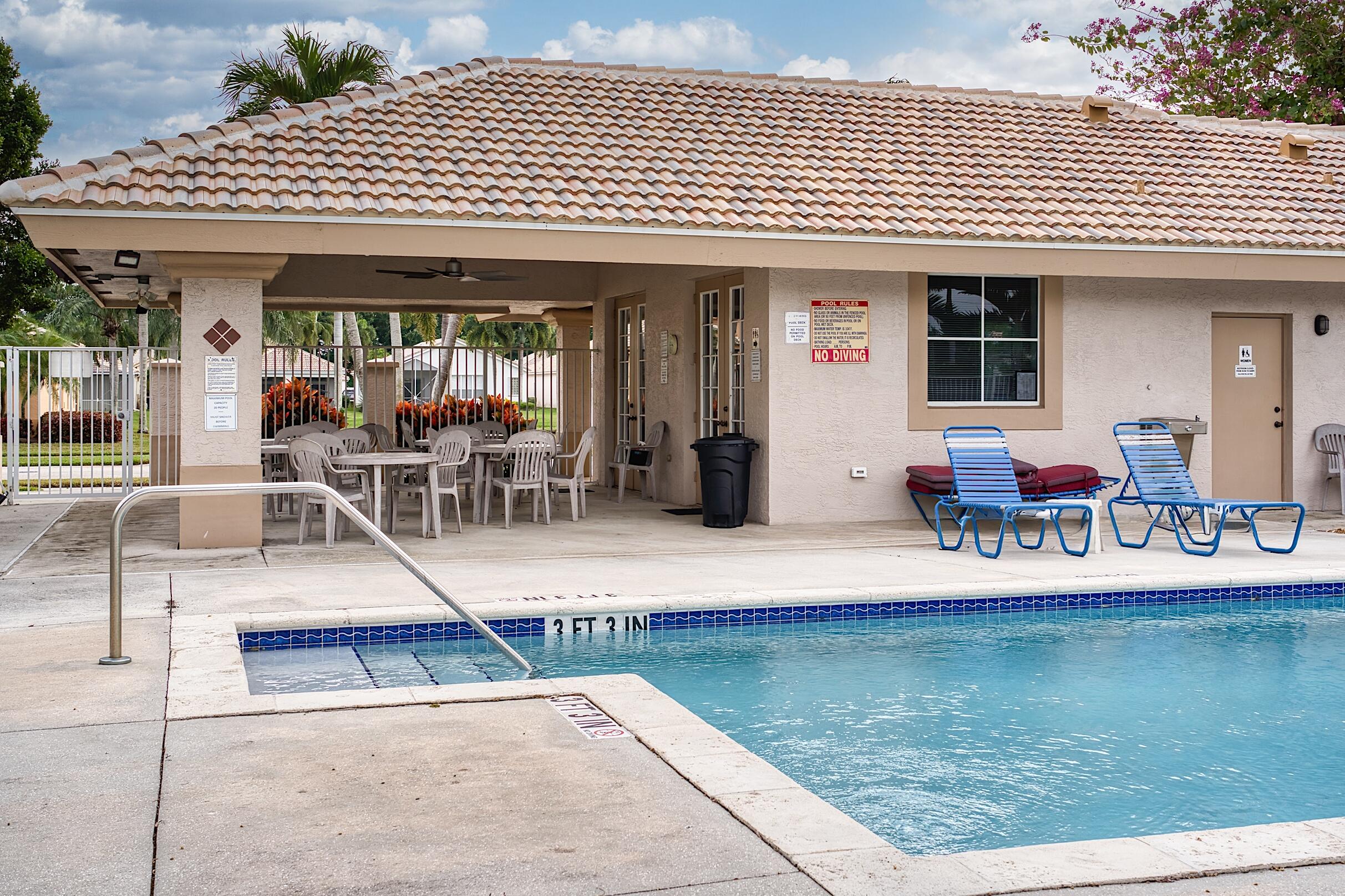 7507 Eagle Point Drive Delray Beach, FL 33446 - Photo 45 of 49 a view of a patio with dining table and chairs