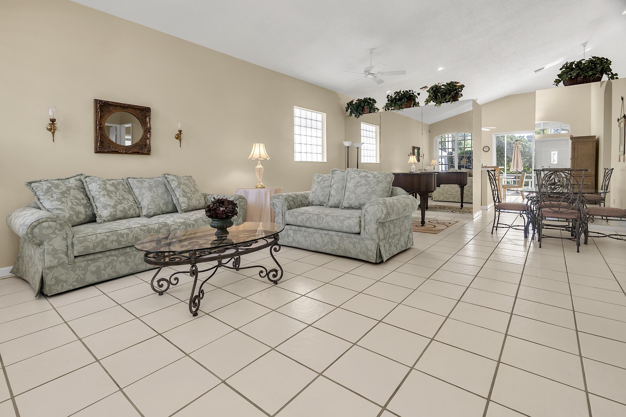 7507 Eagle Point Drive Delray Beach, FL 33446 - Photo 5 of 49 a living room with furniture and a couch