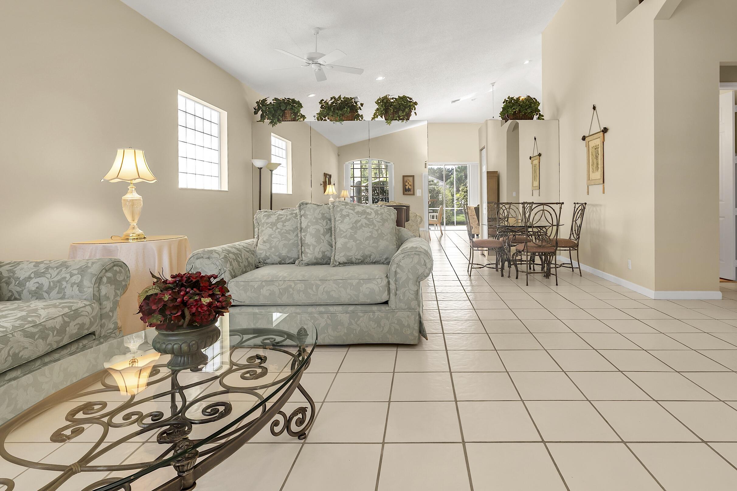 7507 Eagle Point Drive Delray Beach, FL 33446 - Photo 6 of 49 a living room with furniture and a chandelier