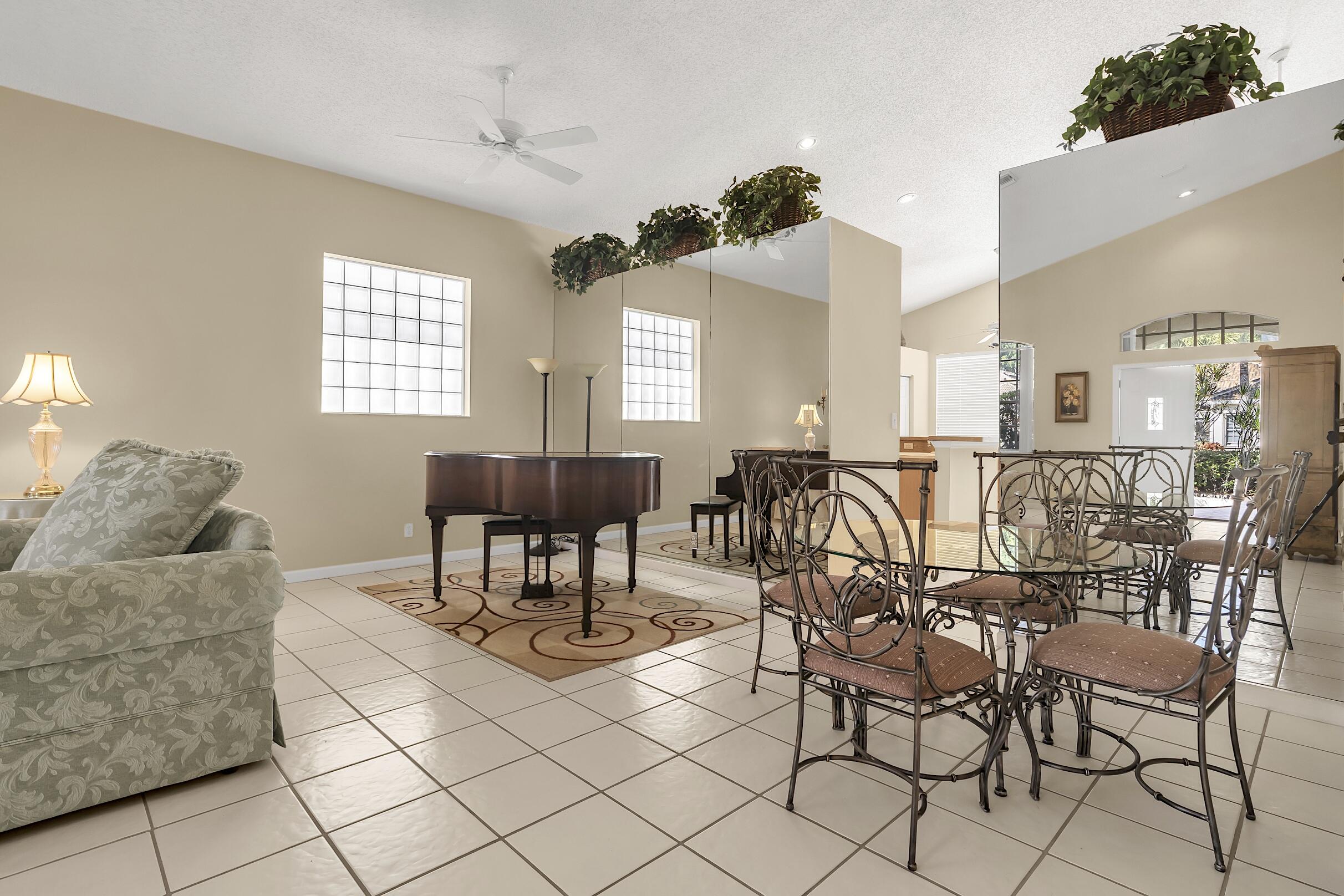 7507 Eagle Point Drive Delray Beach, FL 33446 - Photo 9 of 49 a living room with furniture and a large window