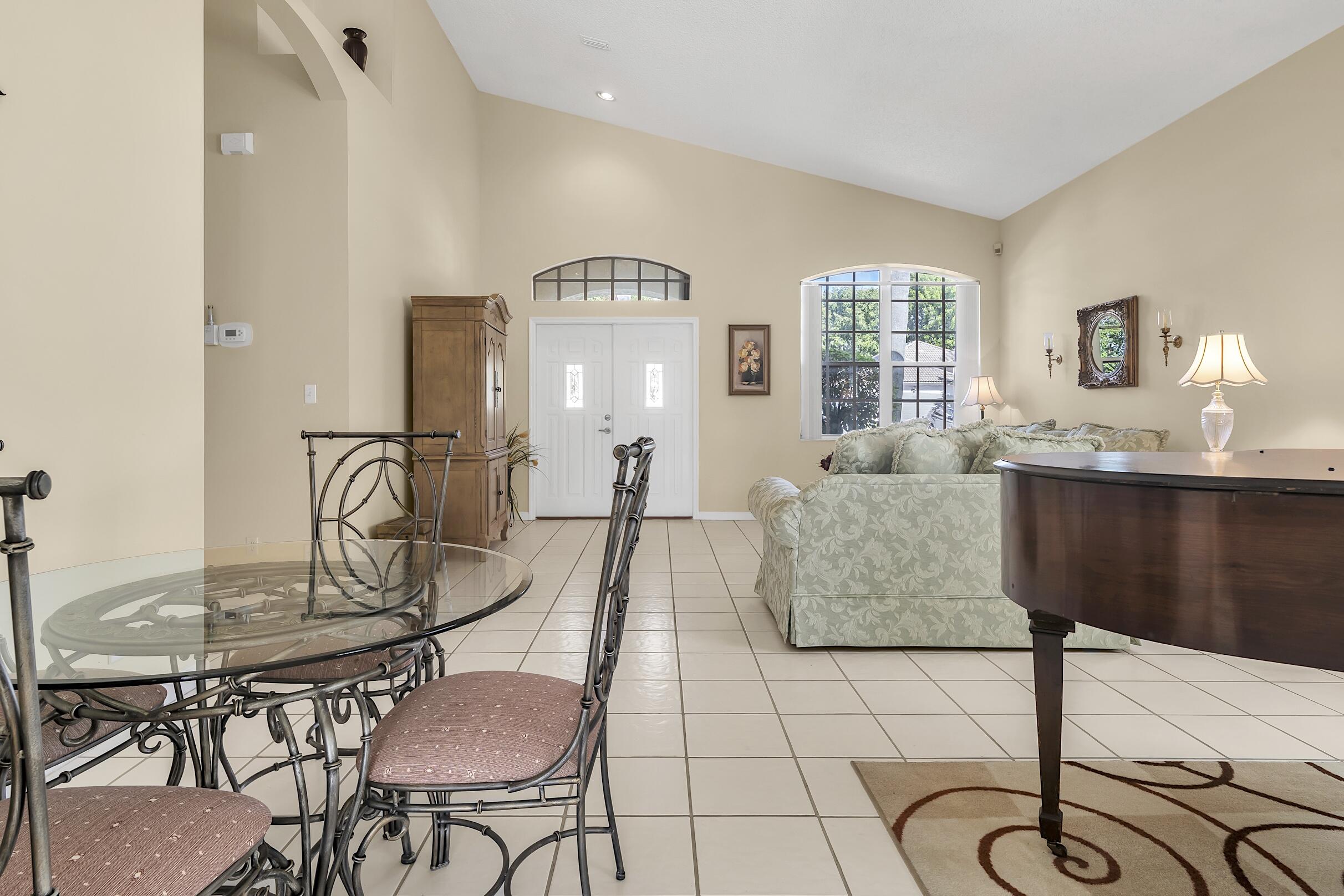 7507 Eagle Point Drive Delray Beach, FL 33446 - Photo 10 of 49 a living room with furniture and dining table