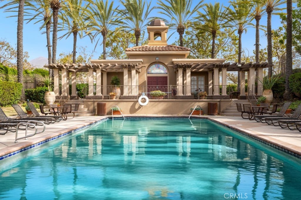 12 Montana Del Lago Drive, Unit 168 Rancho Santa Margarita, CA 92688 - Photo 4 of 23 a front view of a house with a garden