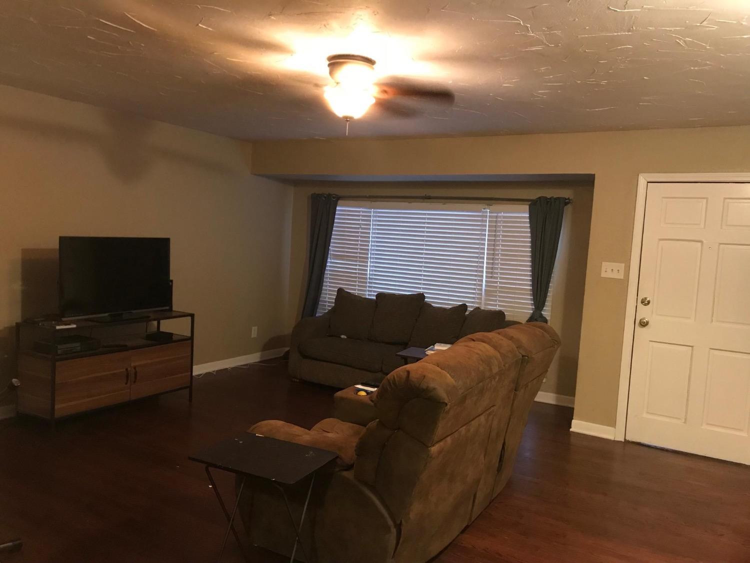 2604 44th Street Lubbock, TX 79413 - Photo 4 of 10 a living room with furniture and a flat screen tv