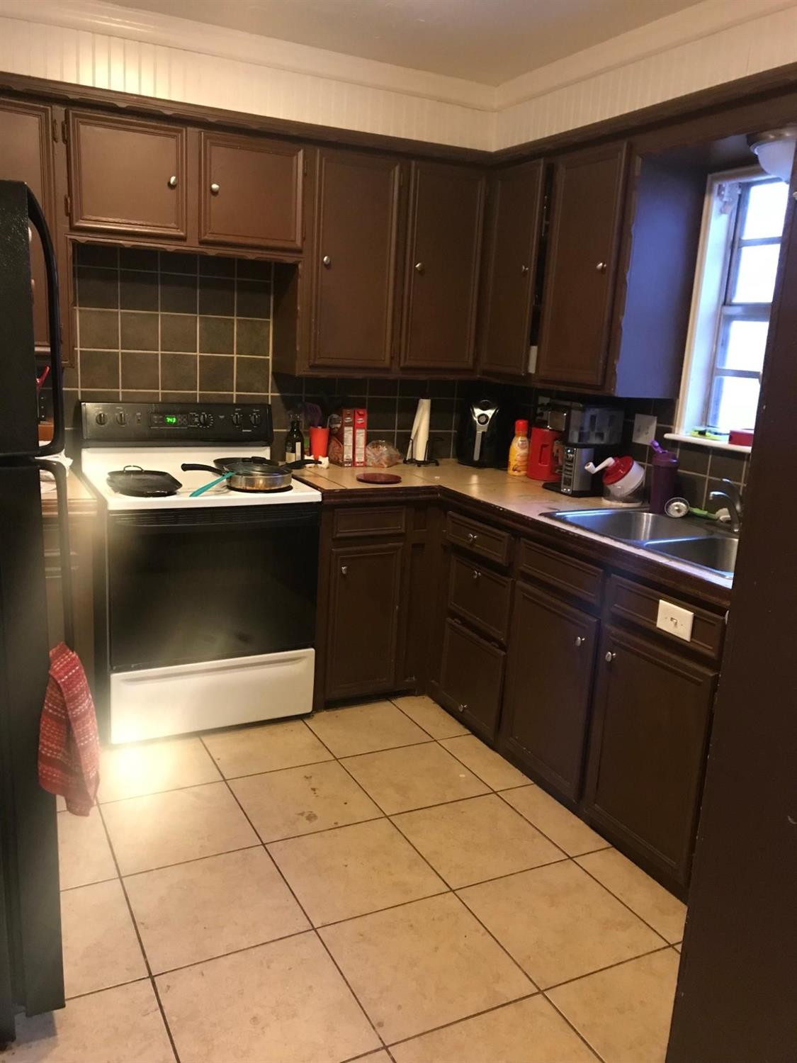 2604 44th Street Lubbock, TX 79413 - Photo 5 of 10 a kitchen with a sink and cabinets