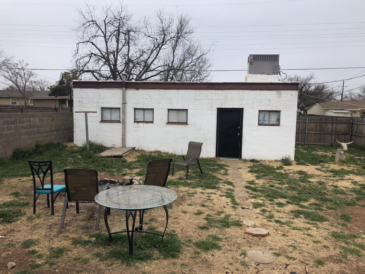 2604 44th Street Lubbock, TX 79413 - Photo 10 of 10 a backyard of a house with table and chairs
