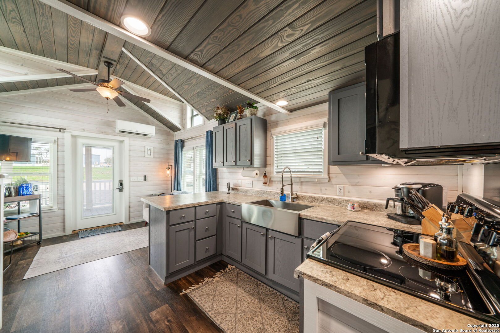 5386 Ranch Road 1376, Unit 172 Fredericksburg, TX 78624 - Photo 11 of 34 a kitchen with a sink a stove and cabinets