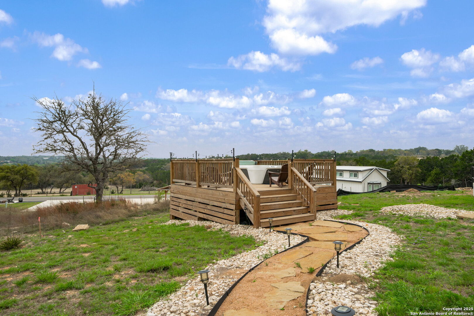 5386 Ranch Road 1376, Unit 172 Fredericksburg, TX 78624 - Photo 20 of 34 a view of a backyard with wooden fence
