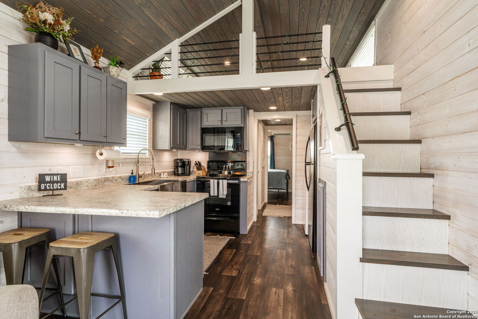 5386 Ranch Road 1376, Unit 172 Fredericksburg, TX 78624 - Photo 8 of 34 a kitchen with cabinets and wooden floor
