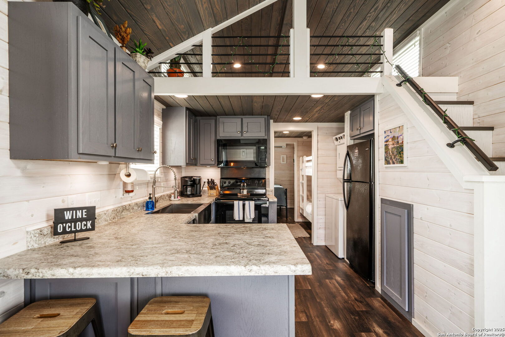5386 Ranch Road 1376, Unit 172 Fredericksburg, TX 78624 - Photo 9 of 34 a kitchen with stainless steel appliances granite countertop a sink refrigerator and cabinets