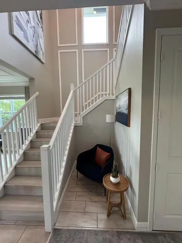 a view of entryway and hall with wooden floor
