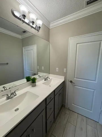a bathroom with a sink a vanity and a mirror