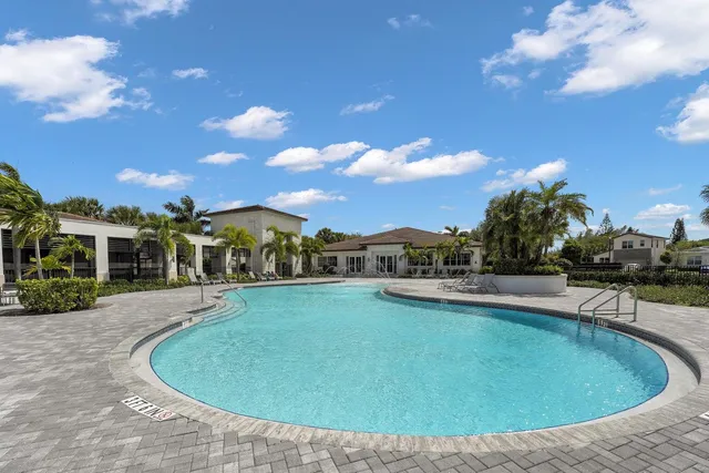 a room with lots of furniture and view of a chandelier