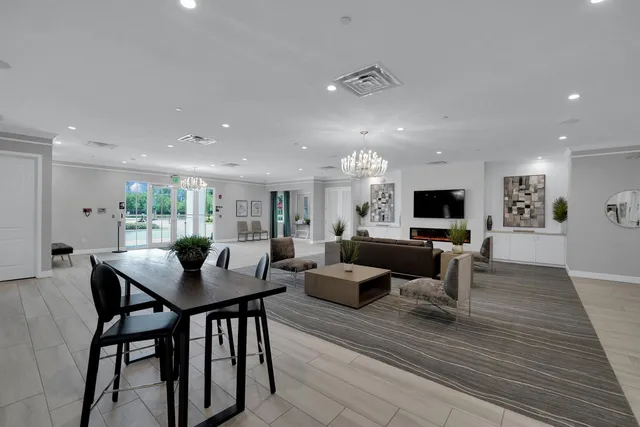 a dining room with furniture window and wooden floor