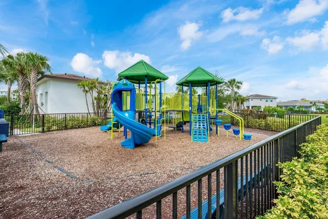 a view of a yard with palm trees