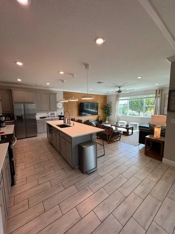 a kitchen with stainless steel appliances lots of counter top space
