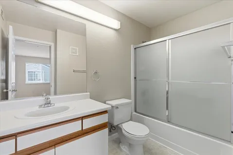 a view of an empty room and closet area