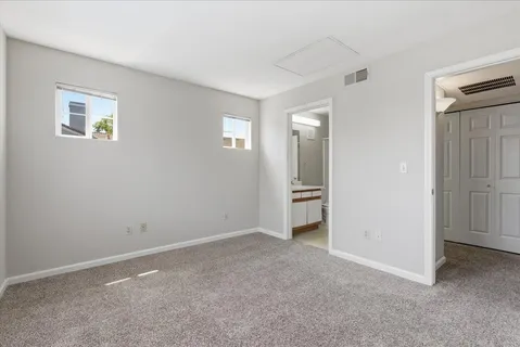 a view of a bathroom from a hallway