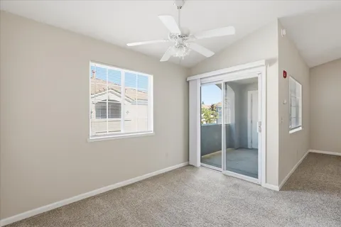 a kitchen with stainless steel appliances white cabinets and a stove top oven