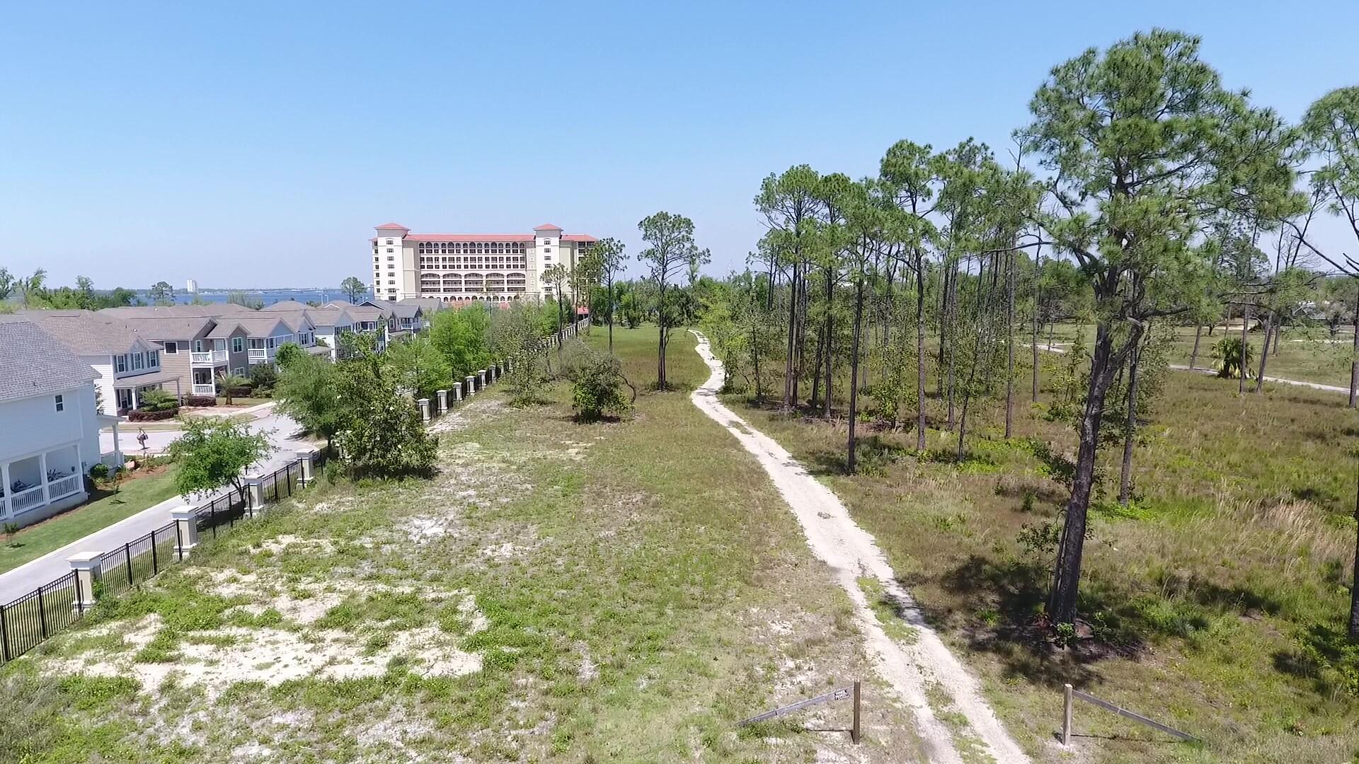 4700 Magnolia Beach Road Panama City Beach, FL 32408 - Photo 15 of 23 a view of a lake with a city