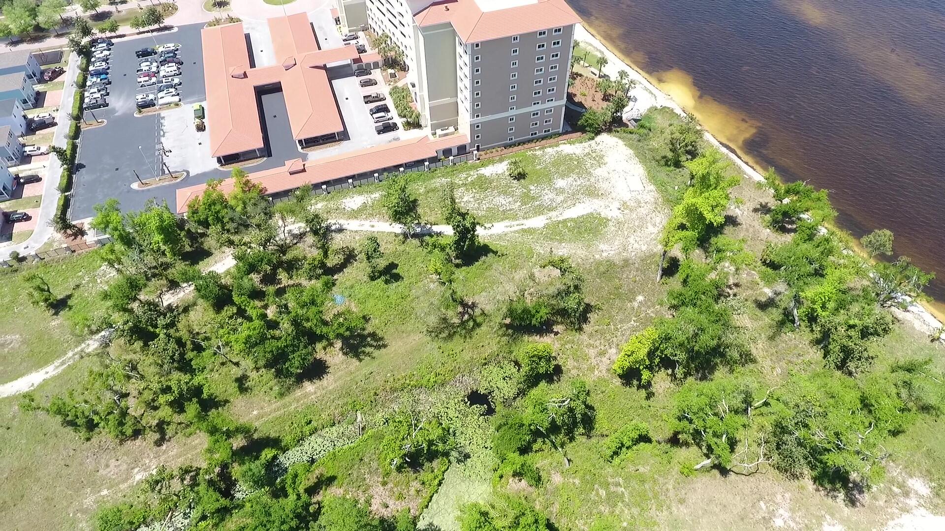 4700 Magnolia Beach Road Panama City Beach, FL 32408 - Photo 9 of 23 a backyard of a building with an outdoor space