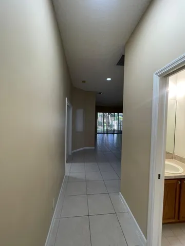 an empty room with a empty space and windows