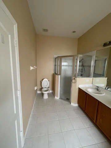 a bathroom with bathtub and shower